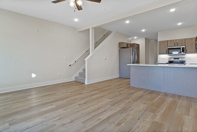 Building Photo - 3 Bed / 2.5 Bath Townhome w/Deck, Walkout Finished Basement, 9' Ceilings, Quartz Tops, Stainless ...