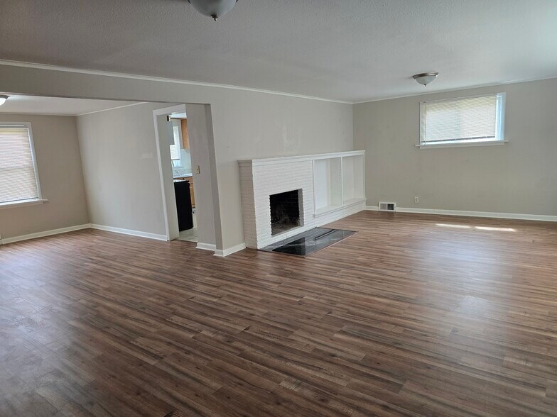 Living & dining rooms w/ new flooring thru-out. - 12105 12th Ave S