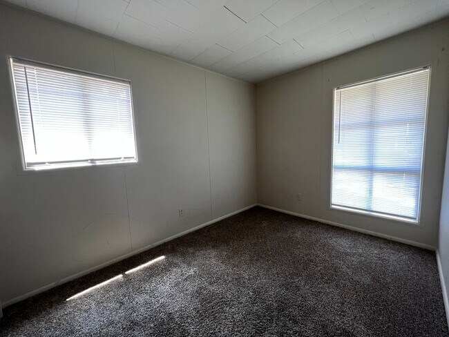 Building Photo - 3 Bedroom, 1.5 Bathroom, Brick Home with yard and Storage Building, Covered Porch