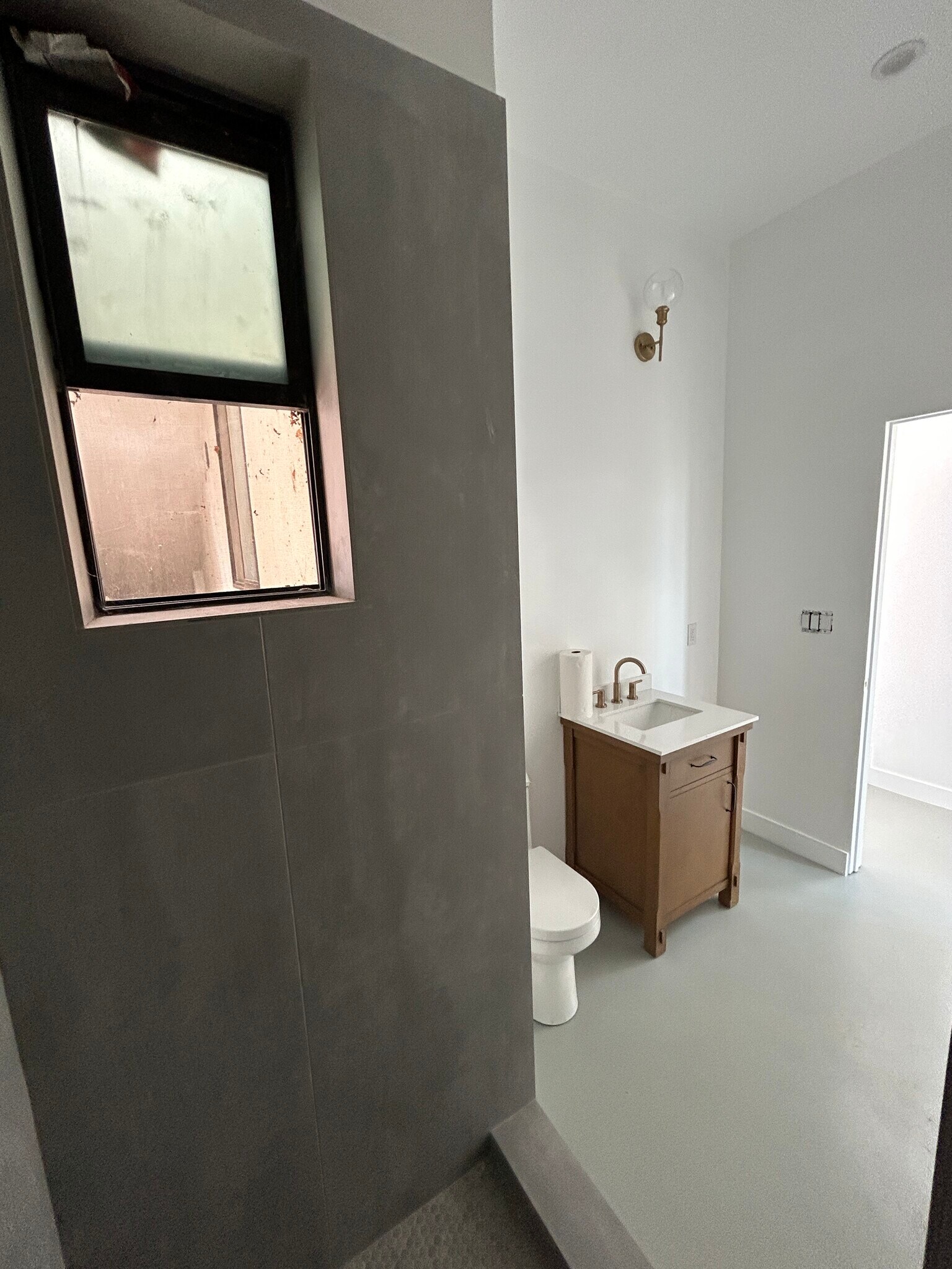 Window in the shower is up high and lets in light - 4435 Radium Dr