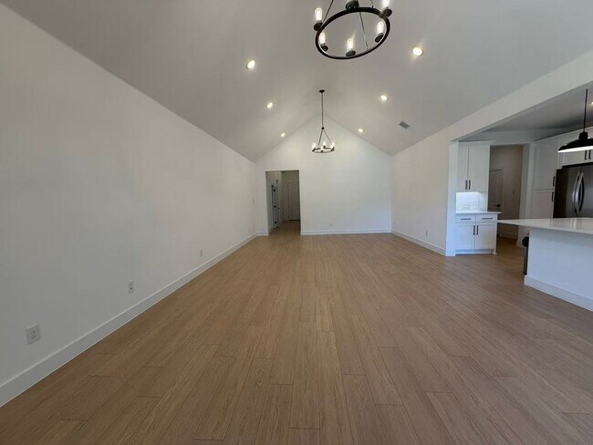 Building Photo - Move-in ready and like-new! Washer, dryer, and refrigerator Included.