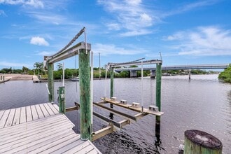 Building Photo - A BOATER'S PARADISE WITH THIS STUNNING 3 BEDROOM, 2 BATH WATERFRONT POOL HOME W/DOCK & BOAT LIFT ...