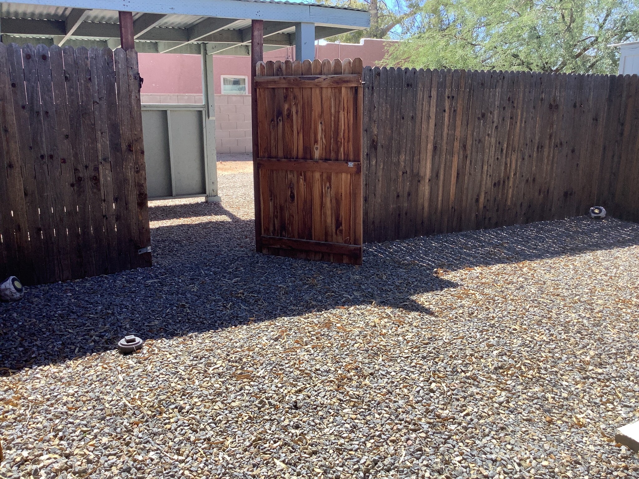 Fenced backyard to carport - 4504 E Linden St