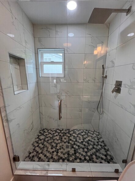 Spacious walk in shower with rainfall shower - 5703 Adelaide Ave