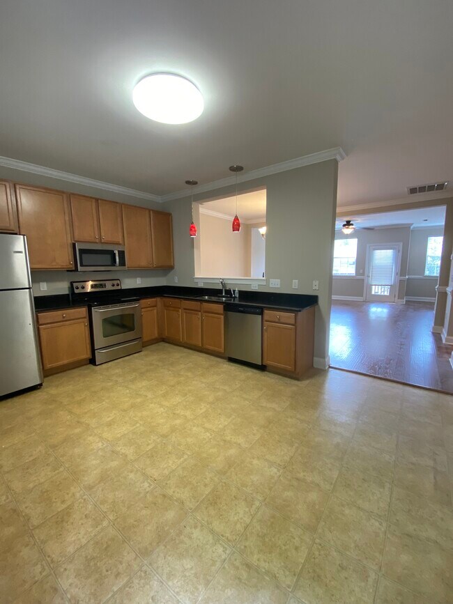 The kitchen is open to the dining area and family room. - 137 High Ridge Rd