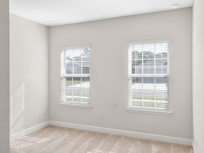 Building Photo - Open concept home offering four bedrooms, three baths, a two car garage and open lanai.
