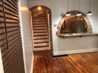 Another view from the living room to the kitchen and the steps to the upstairs. - 116 Bowmar St