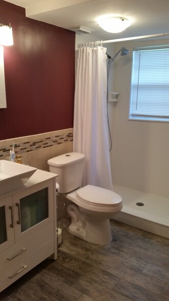 en suite primary bath with tile - 3135 Shady Dell Ln