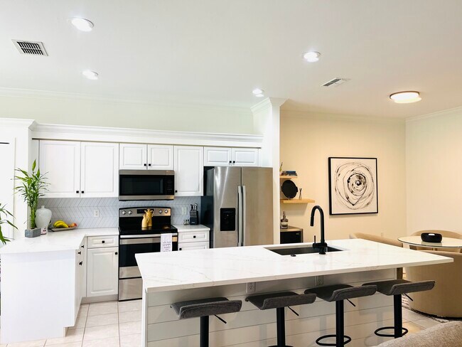 Remodeled kitchen with a wine alcove for relaxing - 1724 Morning Sun Ln