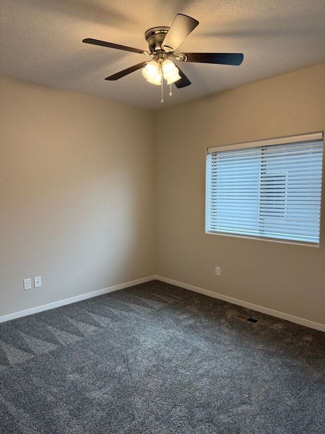 Building Photo - Walkout ranch townhome with 2 stall garage...