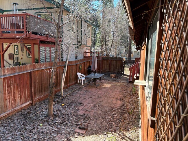 Building Photo - One level cabin with fenced backyard and garage