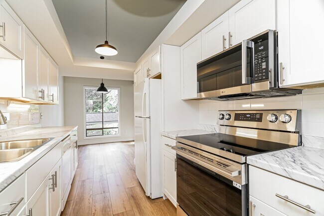 Building Photo - Top-Floor Condo with Forest Views, Large Private Deck & Resort-Style Amenities