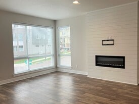Living Room with Ample Windows and Electric Fireplace - 12428 SW 171st Ter