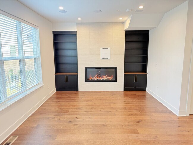 Building Photo - Brand new 4 level, 4 Bedroom Townhome with Elevator!