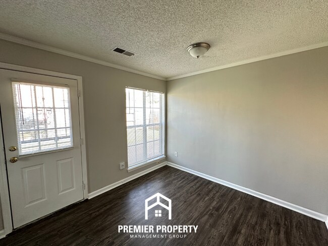 Building Photo - Charming 3BR/2BA Near Southwind | High Vaulted Ceilings, Hardwood Floors & Fireplace