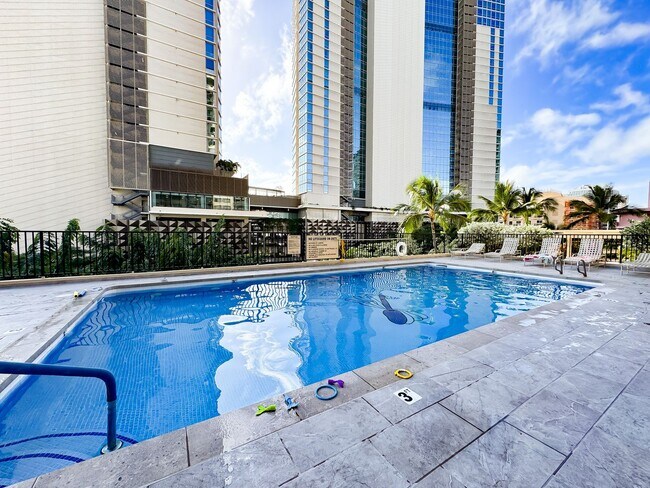 Building Photo - Fully Furnished Waikiki Condo with Direct Ocean Views, Parking, Central A/C