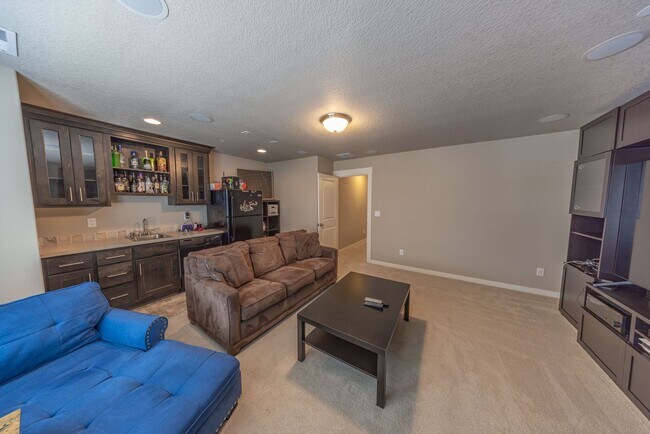 Building Photo - Four Bedroom Home + Bonus & Den in Gated C...