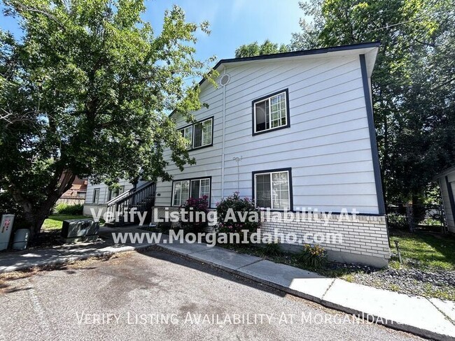 Primary Photo - Patio deck, storage room, covered parking.