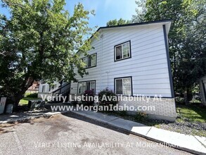 Building Photo - Patio deck, storage room, covered parking.