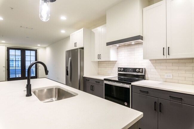 Building Photo - Modern Living Meets Walkable City Charm in...