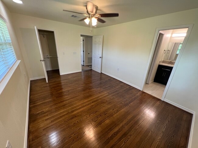 Another view of master bedroom with bathroom entry. - 6015 Heffernan St