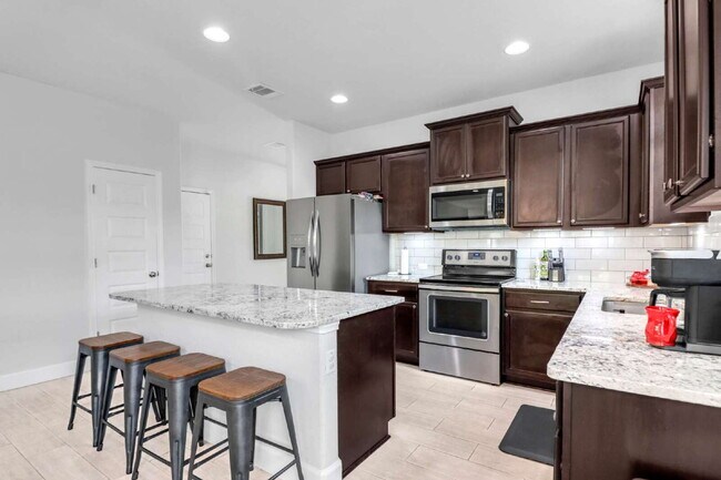 Building Photo - "Charming 3-Bedroom San Antonio Home with Granite Elegance - 1854 Sq Ft of Comfort!"