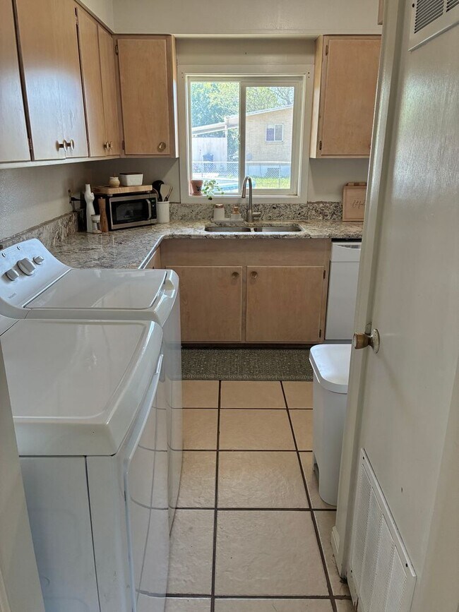 Building Photo - Beautifully remodeled home with central air, 1 car garage, RV parking and covered patio