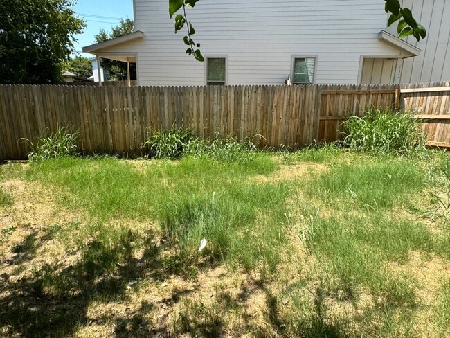Building Photo - Move Fast! Gated Townhome Near Lackland AFB with Private Yard & EV-Ready Garage