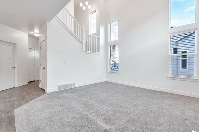 Building Photo - ROW END TOWNHOUSE W 2 CAR GARAGE + AMENITIES