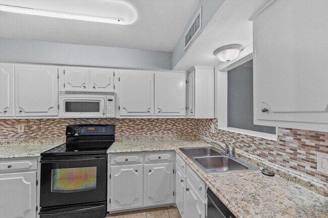 Building Photo - Bright & Updated 2-Bedroom Townhouse in Quiet Community with Pool Access!