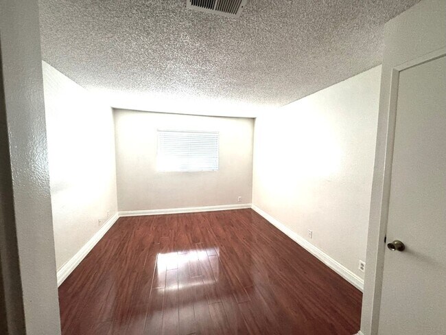 Building Photo - 2 Bedroom, 2 Bath Upstairs Condo with Private Balcony & 2-Car Garage, Gated Community, Water/Tras...