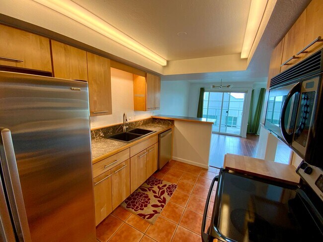 Building Photo - 1,300+ Sq Ft 2BR Condo w/ Parking, W/D & Utilities Included | $1,000 Move-In Credit