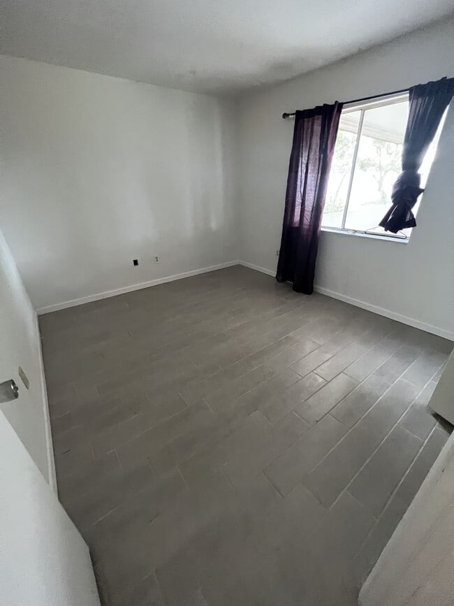 Building Photo - Annual Rental ** Newly Updated 2 Bed / 1.5 Bath Single Family - Tile Floor / Oversized Lanai ** $...