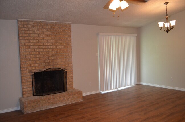 Building Photo - This 3 Bedroom Home with Fireplace is a must see!