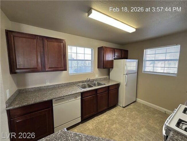 Building Photo - Bright Northwest Second-Floor Condo with Oversized Balcony & Community Pool!