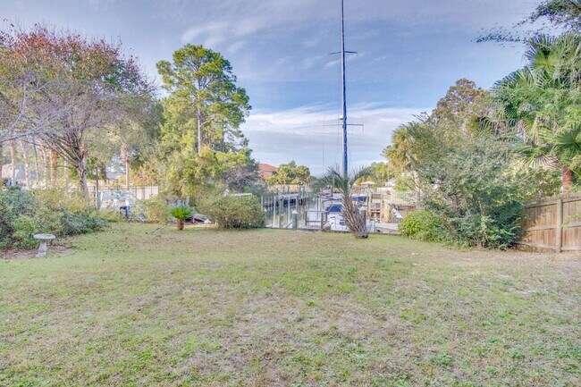 Building Photo - Live the Gulf Breeze Waterfront Life – Dock, Canal Access & Boat Lift!