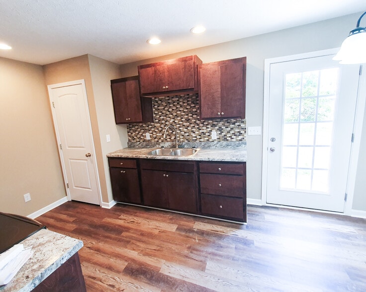 kitchen comes with stainless steel appliances (microwave, stove, and fridge) - 406 Hedgemont Ave