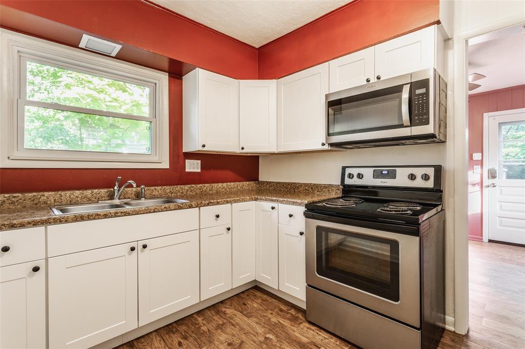 Updated kitchen with elec range/oven, microwave, countertop dishwasher - 5750 Rawles Ave