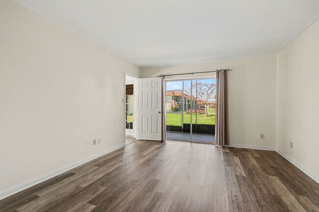 Building Photo - Must see 1st floor, end unit with lots of natural light in St Lucie Gardens.