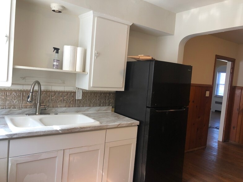 Kitchen with private rear entrance - 1711 Portman Ave