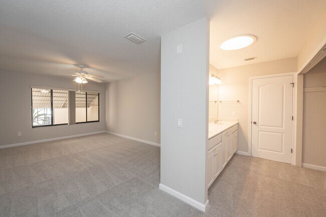 Building Photo - Welcome to this spacious three-bedroom, three-bath home in the heart of Palm Bay