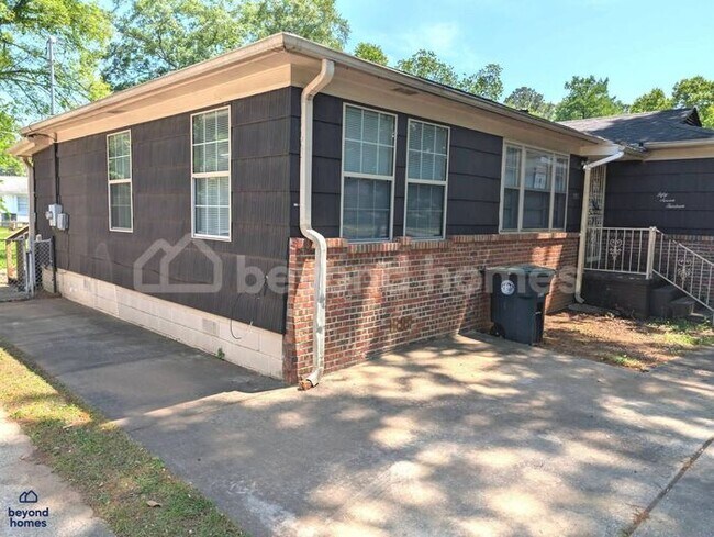 Building Photo - Updated Bungalow with Massive Deck and Fully Fenced Yard!