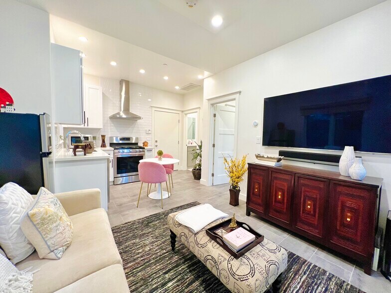 Living area with adjoining kitchen - 4206 Pomona Ave