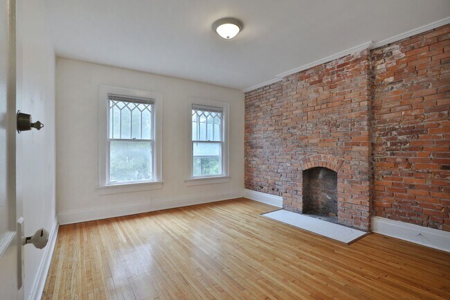 Building Photo - Charming 5-Bedroom Home with Exposed Brick and Modern Upgrades