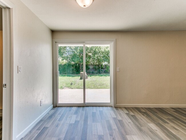 Building Photo - 4 Bedroom/2 Bath home with fenced yard.