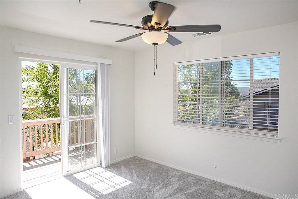 Bedroom 2 is 10' 6" x 12' 4" with new ceiling fan and private balcony - 3051 Augusta St