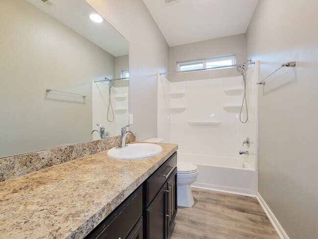Building Photo - Welcome to this charming one-story home fe...