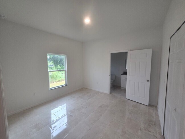 Building Photo - Brand New 2/2/1- SW Lehigh Acres