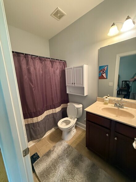 1st level bedroom attached bath - 2615 Stewart Pines Dr