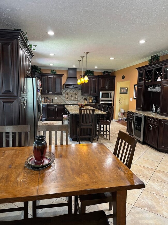 Building Photo - Updated & Landscaped 4 Bedroom, 4 Bath Hom...